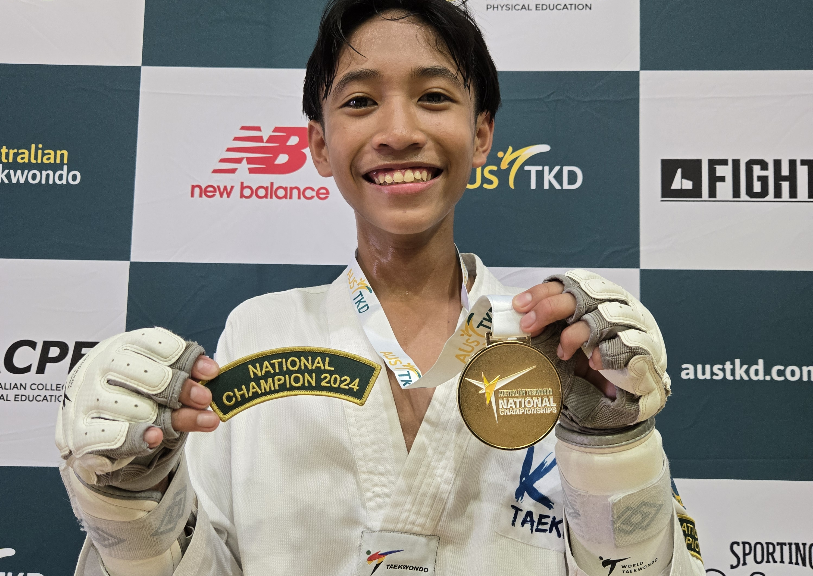 Students proudly displaying their competition awards and trophies